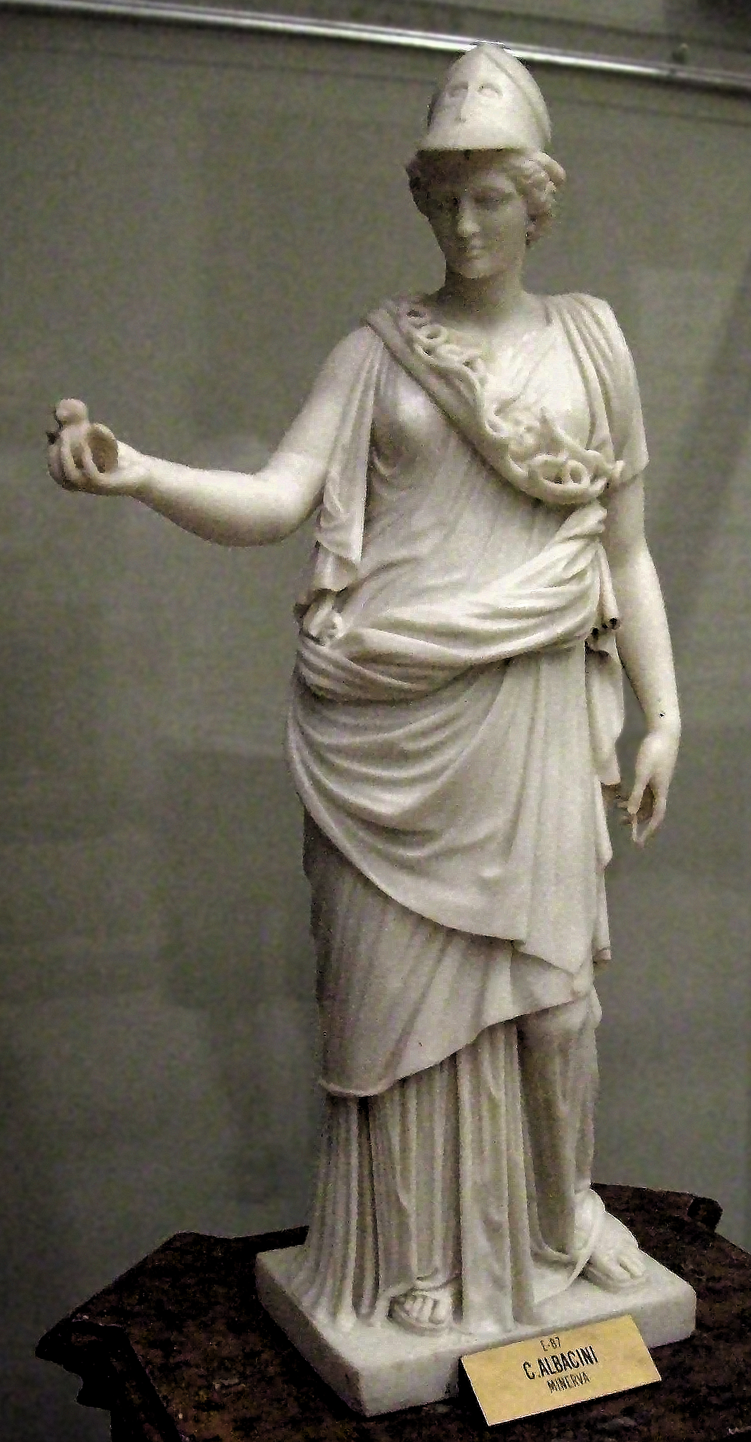Statue of MINERVA, at the Museum of the Royal Academy of Fine Arts of San Fernando, in Madrid (Spain). Sculpted in white marble by Carlo Albacini (active between 1770 and 1807).. Dimensions: 77 x 42 x 13 cm.